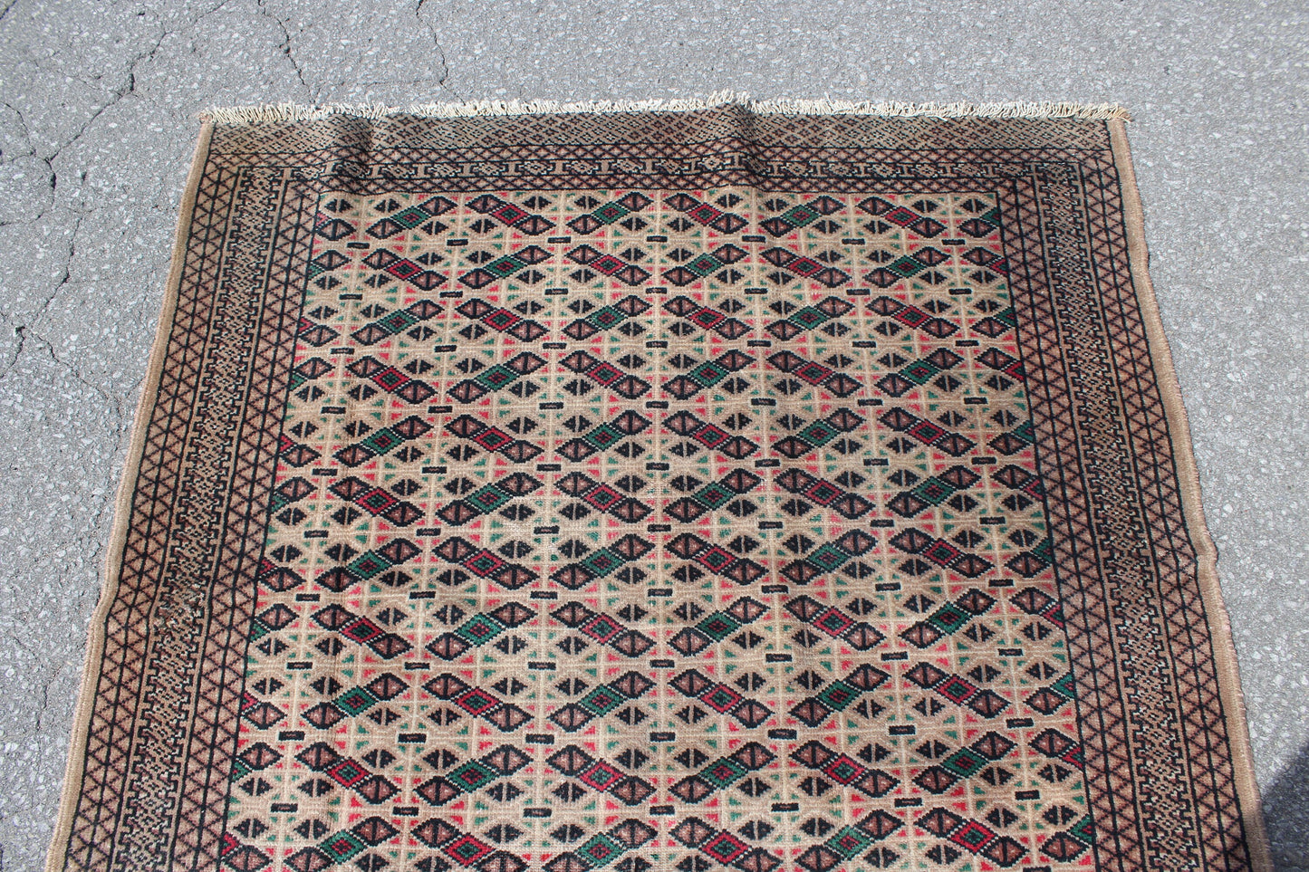 Cream Area Rug with Red Green Geometric Designs