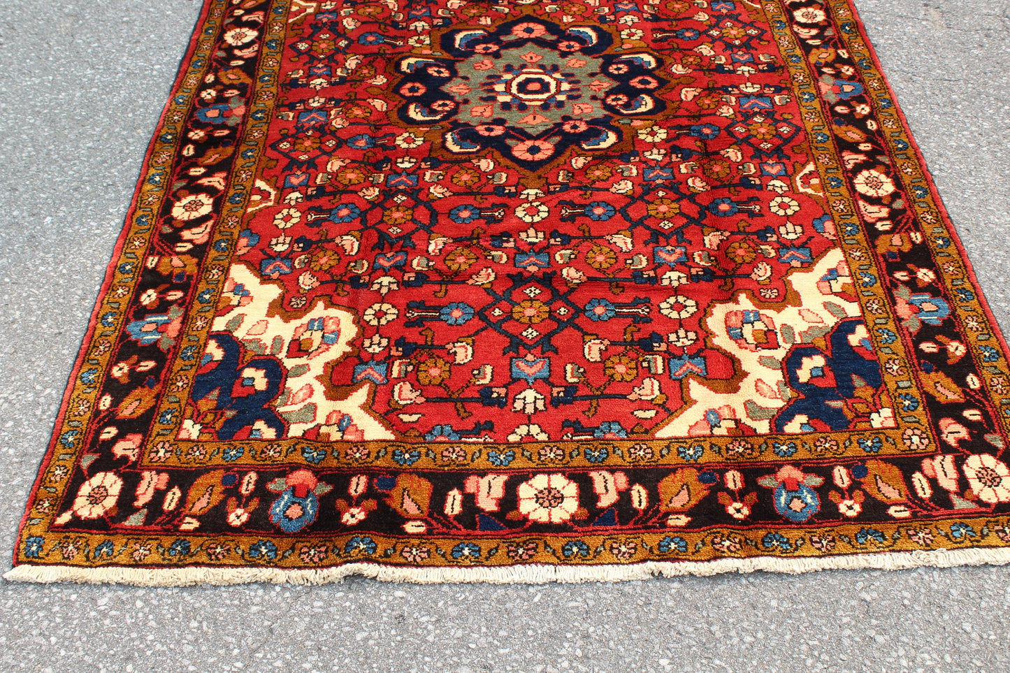 Red Oriental Rug with Navy Blue Border Yellow Accents | 4'7" x 7'7"