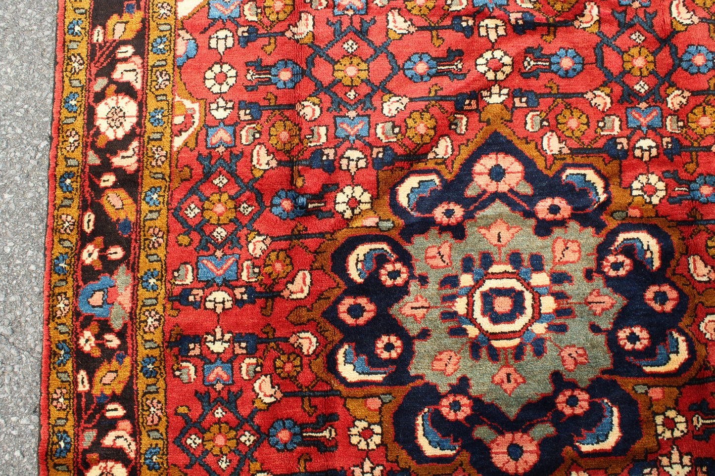 Red Oriental Rug with Navy Blue Border Yellow Accents | 4'7" x 7'7"