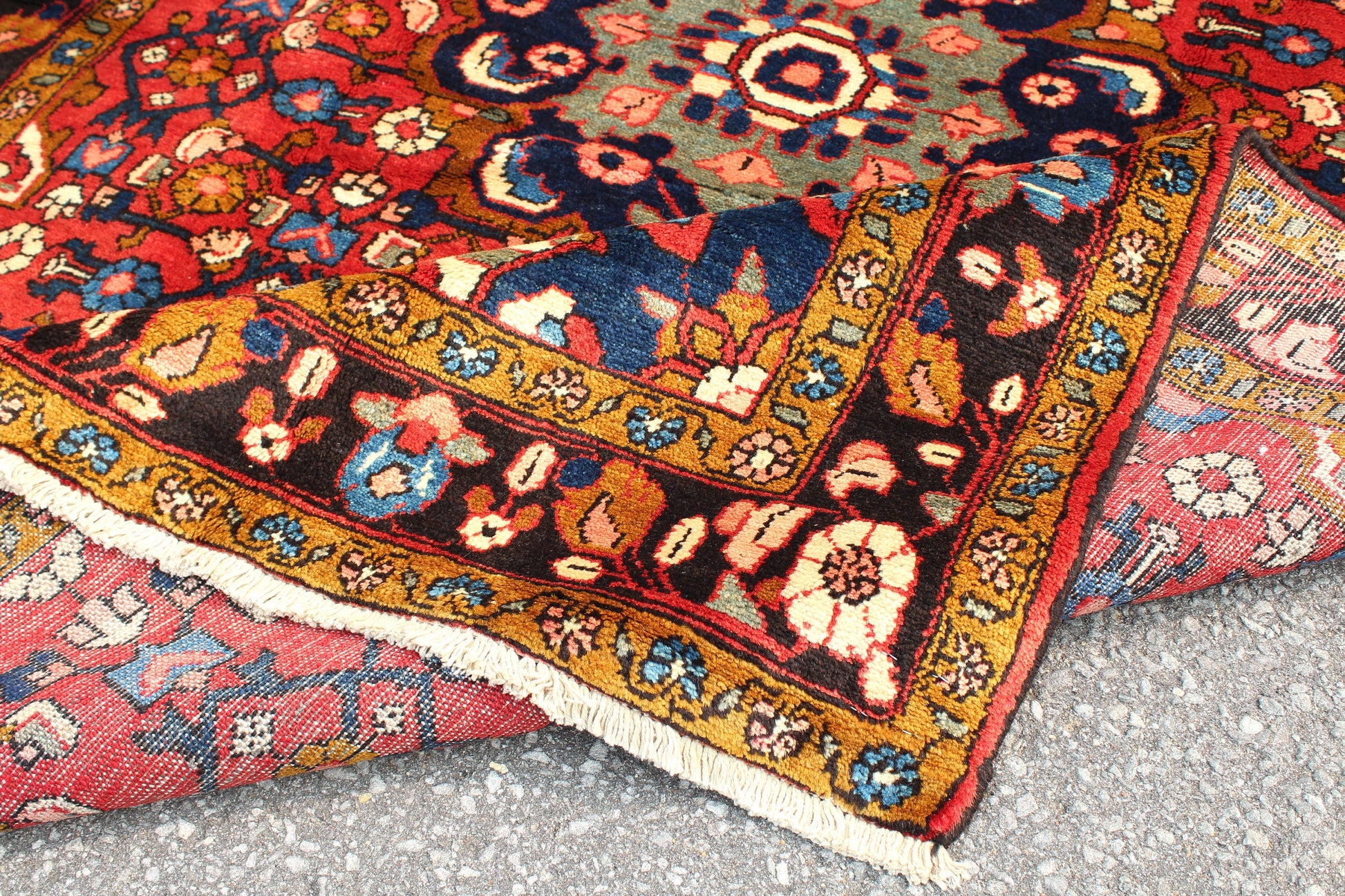 Red Oriental Rug with Navy Blue Border Yellow Accents | 4'7" x 7'7"