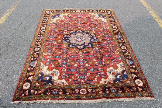 Red Oriental Rug with Navy Blue Border Yellow Accents | 4'7" x 7'7"