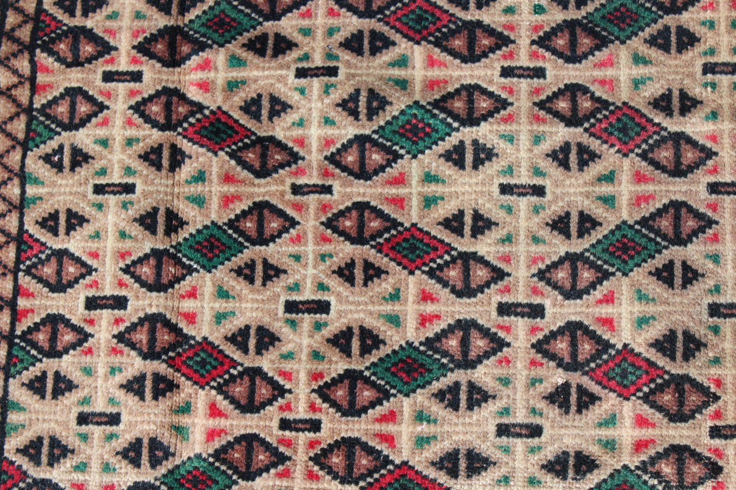 Cream Area Rug with Red Green Geometric Designs