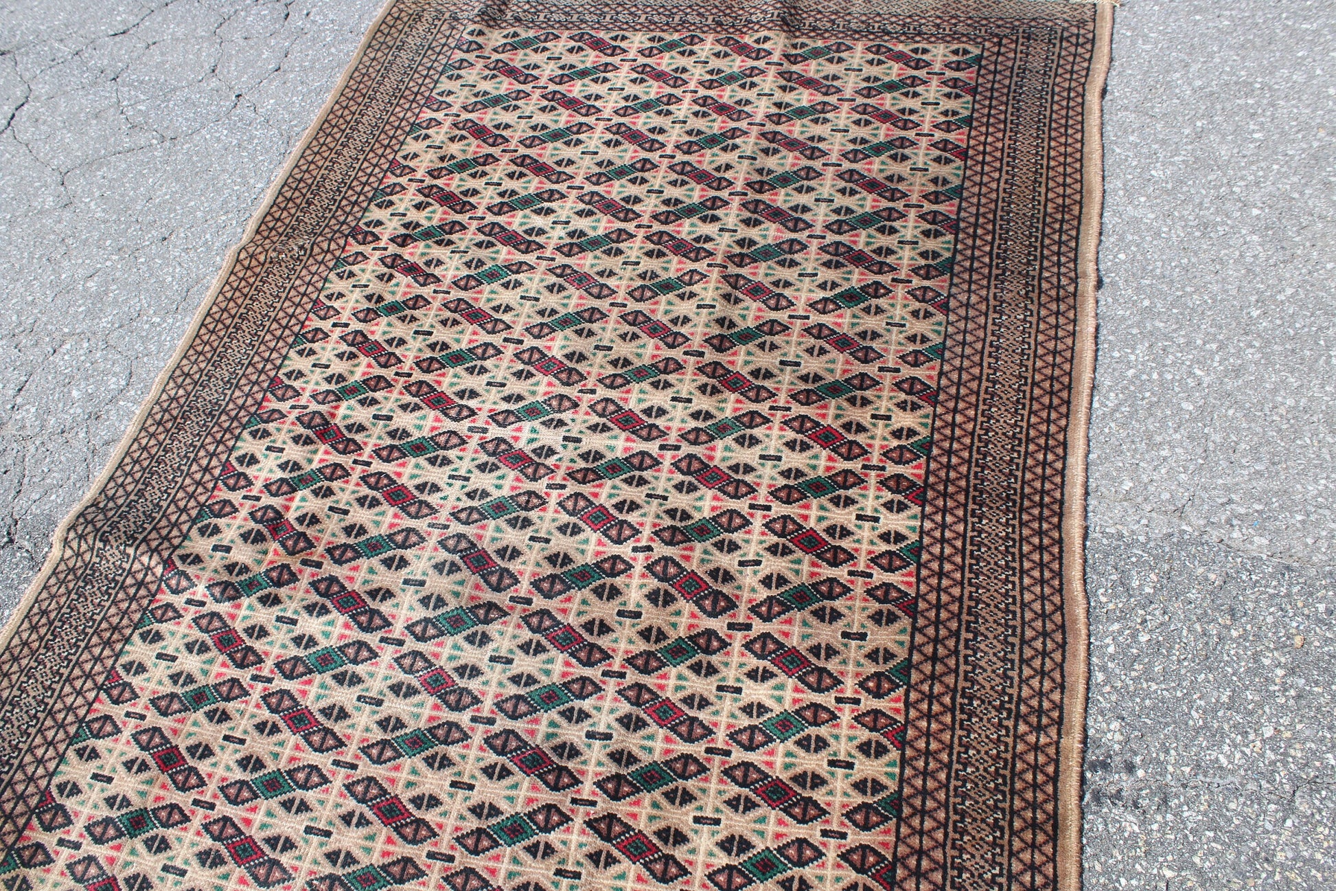 Cream Area Rug with Red Green Geometric Designs